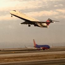 I got this sweet double shot with Delta Connection taking off and Southwest holding short (riding in the back) at SFO.